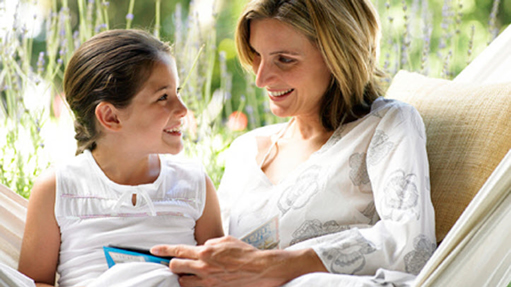 mom reading to daughter